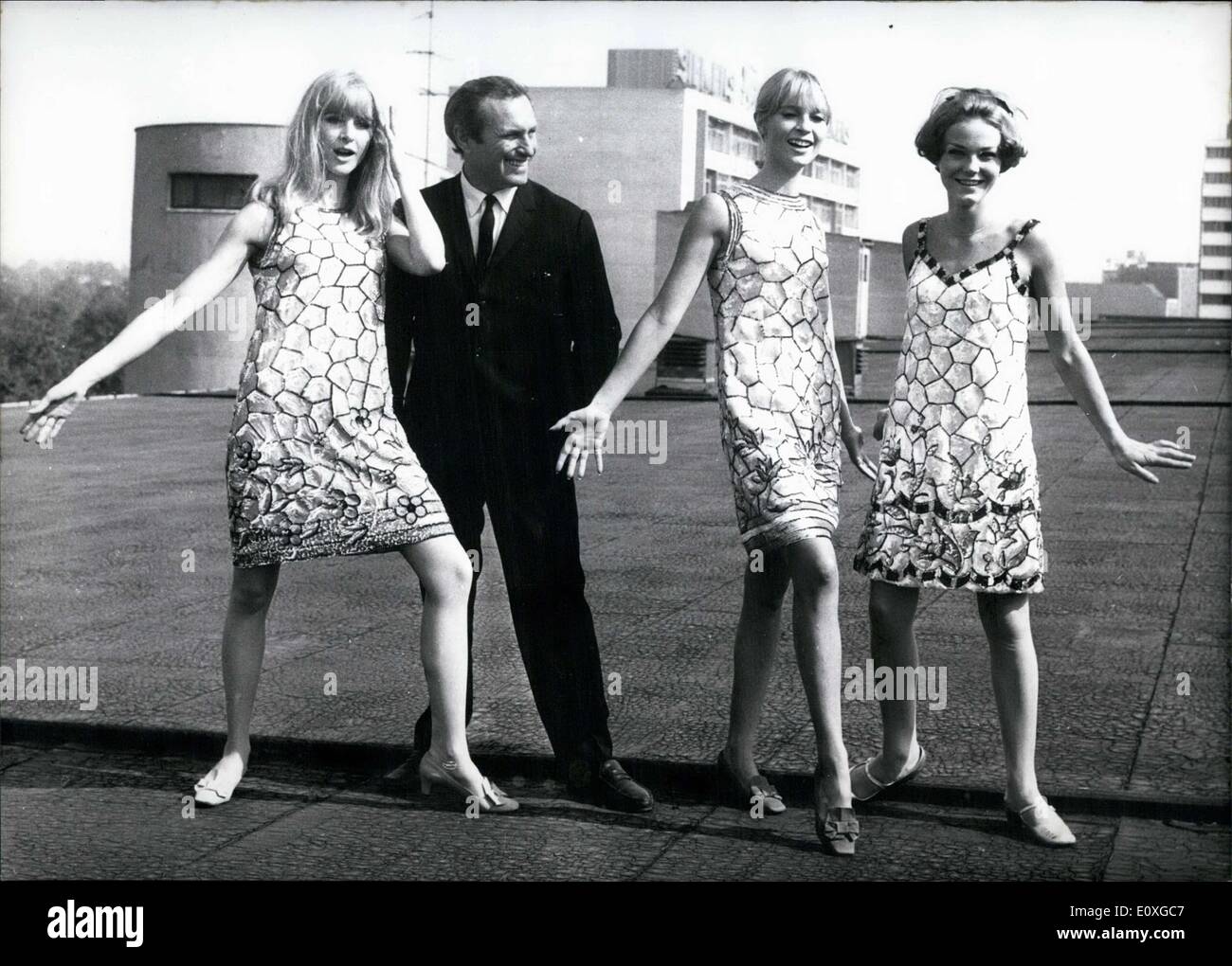 Sep. 13, 1966 - Pictured is fashion designer Louis Feraud on the rooftops  of Berlin. He is shown here with several of his models. The three models  are all named ''Tiffany'' and