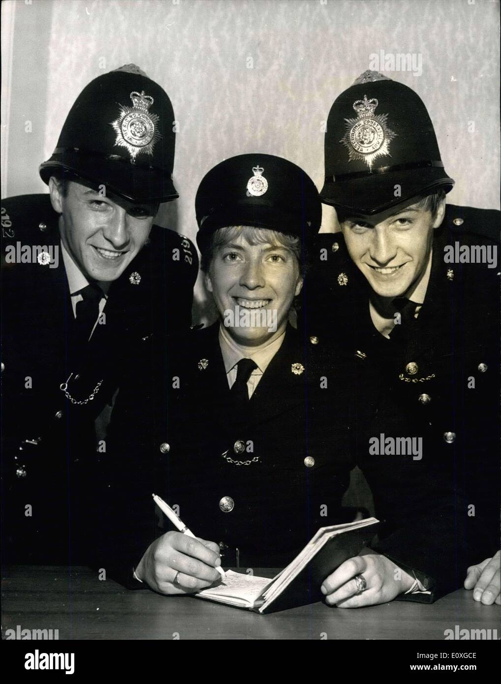 Sep. 16, 1966 - Policewoman Recruiting The Family. The Soft persuasive voice of pretty Joan Williamson is boosting the establishment of the West Riding constabulary - for Joan is talking her whole family into joining the force. When the second of her 19 year old identical twin brother was sworn in at Wakefield (Sept 13) as a constable Joan was there to welcome him into the fold. Now Joan, her twin brothers, and her husband are all serving in the West Riding police Stock Photo