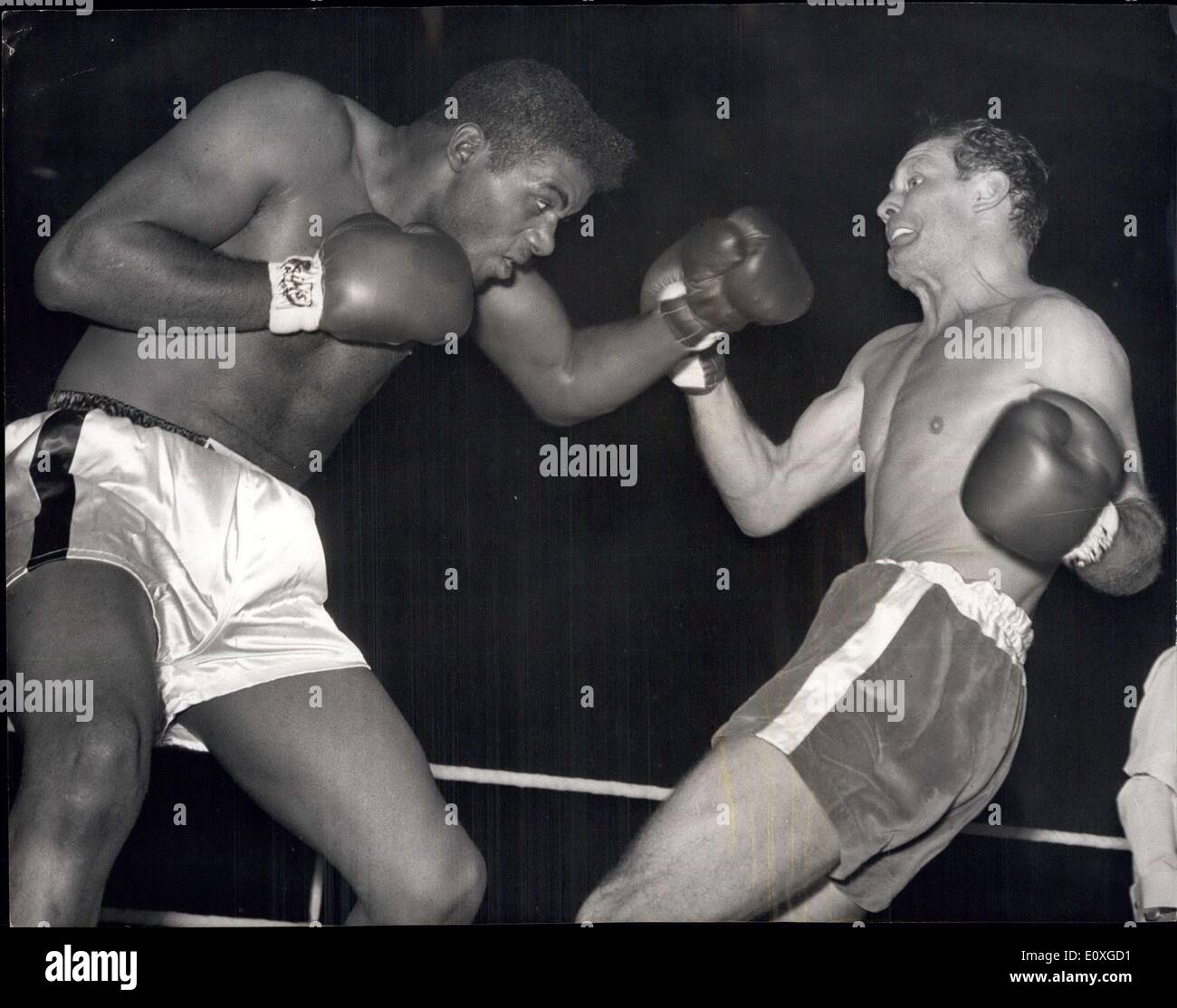 Sep. 21, 1966 - Floyd Patterson knocks out Henry Cooper: Flyod Patterson knocked out British heavyweight champion, Henry Cooper, in the fourth round of their scheduled 10-round contest, at Wambley last night. Photo shows Floyd Patterson, the former world heavyweight champion, drives Henry Cooper (right), onto the ropes in the first round at Wembley last night. Stock Photo