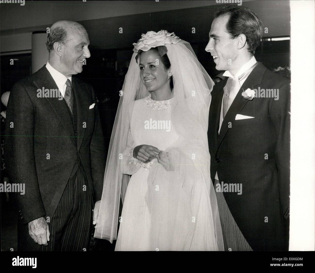 Sep. 26, 1966 - Wedding Reception at Royal Festival Hall - Olga Forte, Daughter of Mr. and Mrs. Charles Forte, was Married today at St. Mary's Hampstead, to Alessandro, eldest son of General and Marchesa Polizzi di Sorrentino, of Rome. Seven Hundred guests attended the reception whih was held at the Royal Festival Hall. keystone Photo Shows:- Ex-King Umberto of italy, Left, Chats to the Bride and Groom at the Reception today. Stock Photo