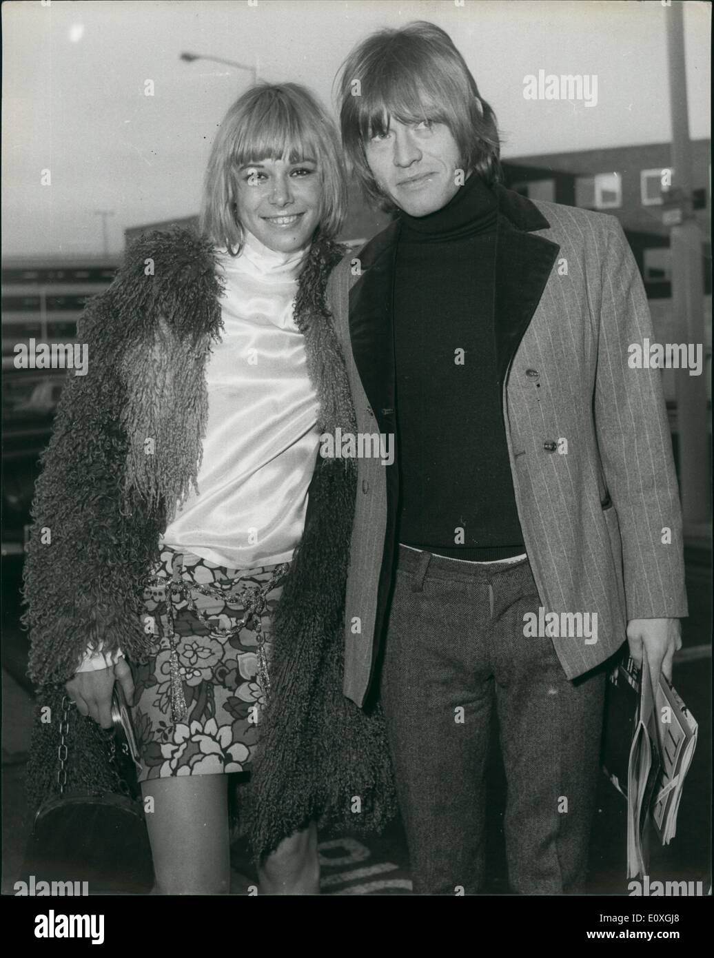 Dec. 12, 1966 - German Actress arrives by Air after Rumours that she is to marry Brian Jones of Rolling Stones: Blonde German actress Anita Pallenberg, age 19,   London today following rumours that she is about to marry the Rolling Stones guitarist, Brian Jones. She was met on arrival at London Airport today by Brian. Photo shows German actress Anita Pallenberg pictured with Brian Jones when she flew into London Airport from Munich today. Stock Photo
