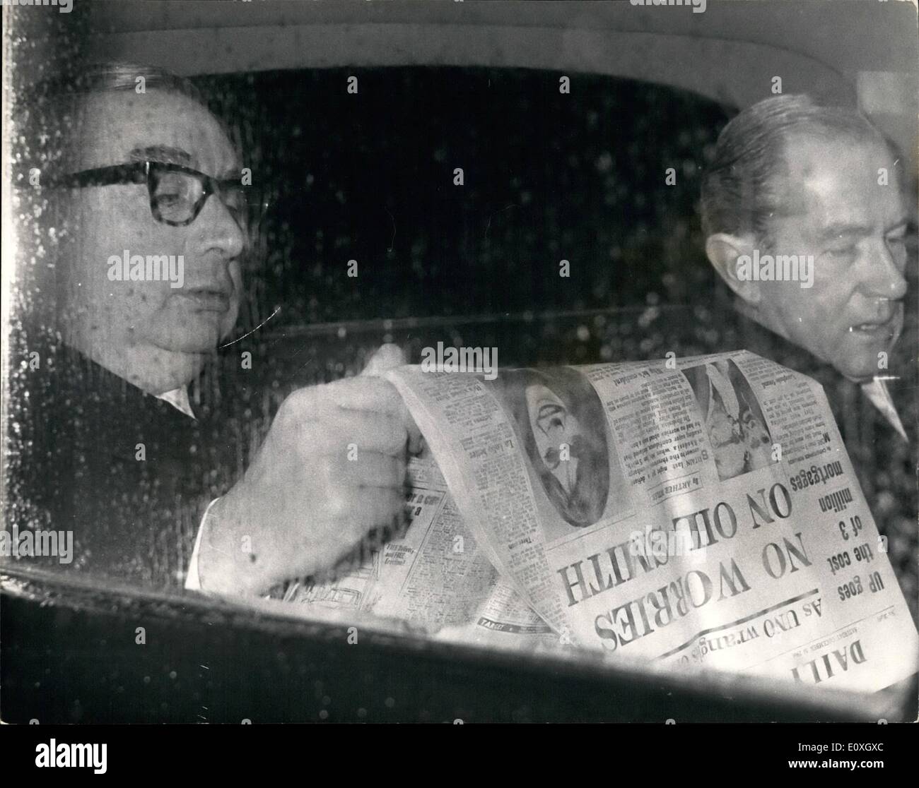 Dec. 12, 1966 - Mr. George Brown home from America: Mr. George Brown the foreign Secretary arrived back this morning at London Airport from he visit to the U.N. in which he make a speach on the Rhodesia Crisis. Photo Shows Mr. Brown seen in his car after arriving back from the U.S. reads the now about no worries an oil-as said by Mr. Smith. Stock Photo