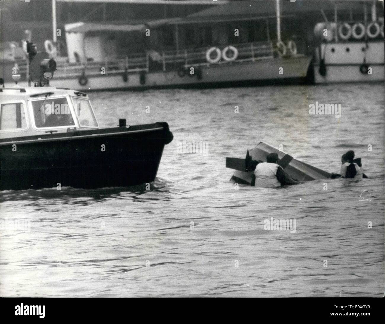 Dec. 12, 1966 - A demonstration Mishap.: Britain was introduced to a new water sport in the heart of London, yesterday, when a two-seater hydrofoil made its debut on the Thames. The new craft is the smallest and cheapest fail riding craft is the smallest and cheapest fail riding craft in the world. Hi-Foiling is a completely new experience in aquativ sport. The craft is less than nine feet long, is powered by an outboard engine and has handle bar steering. it operates liek any other craft up to ten to fifteen miles an hour Stock Photo