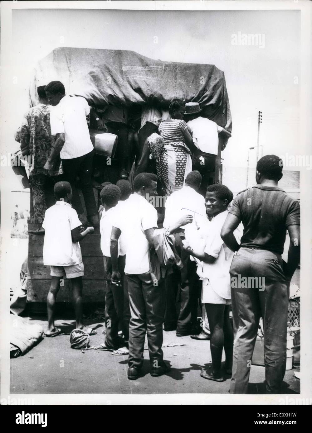 Oct. 10, 1966 - Tribal Conflicts uproot Nigerians: Eastern Nigerians packing their luggage and families into back-breaking mammy-wagons which would take them back from Lagos, the federal capital to the East. Stock Photo