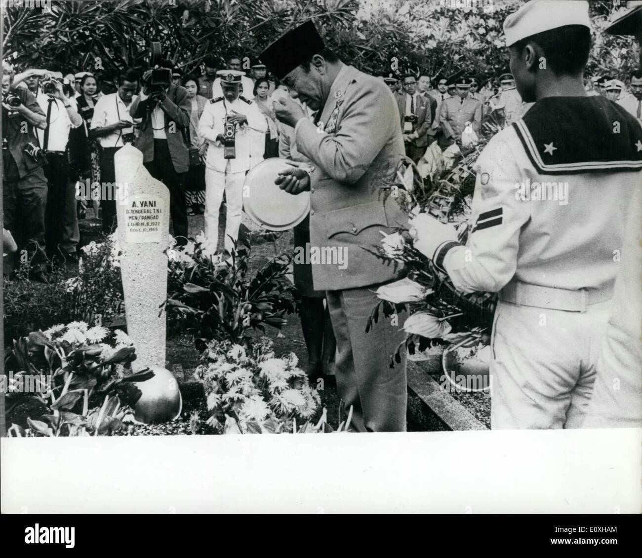 Oct. 10, 1966 - Sukarno Weep at Grave of Slain General. President Sukarno weeps as he stands before the grave of General Ahmad Yani, his former C in C, who was slain by the Communist in last October's abortive coup, together with five other senior generals. This is the first time Sukarno has paid tribute to the butchered officers graves. Sukarno is being accused of knowing the coup was being engineered, and the disappearance of the generals would restore his diminishing power, as they were opposing many of his actions Stock Photo