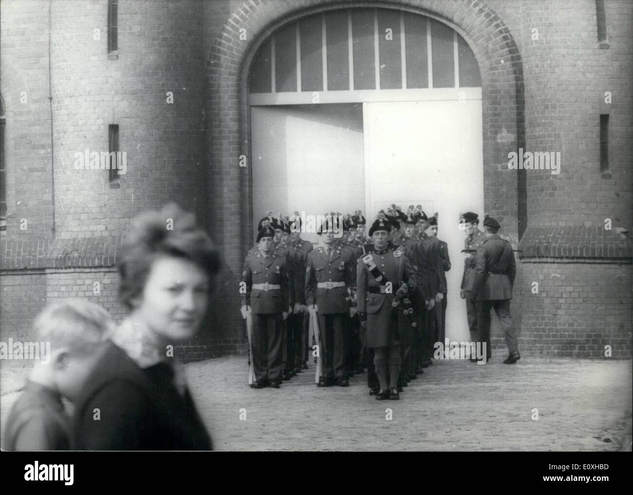 Oct. 10, 1966 - Wake up changing in Spandau Prison A new-wake up changing took place at Spandau prison after leaving of Speer and Schirach. The new crew has to wake for only one prisoner now, the 71 years old Rudolf Hess. But maybe it was a moment of history for the British soldiers when they leaved the prison, it was maybe their last wake service. The Allies wants to talk next time, to find an other place for Hess. OPS: British Soldiers are leaving the prison in Spandau. Stock Photo