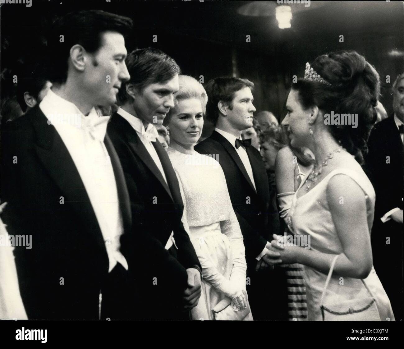 Feb. 02, 1967 - Princess Margaret attends Royal Film Performance.: H.R.H. Princess Margaret this evening attended the 1967 Royal Film Performance, of the film ''The Taming of the Shrew'',starring ELizabeth Taylor and Richard Burton, at the Odeon Theatre, Leicester Square, London o aid the Cinema and Television, Benevolent Fund. Photo shows Princess Margaret seen speaking to Per Oscarsson of Sweden, who is an actor, On his left is Laurence Harvey, and on right is Martha Hyer. Stock Photo
