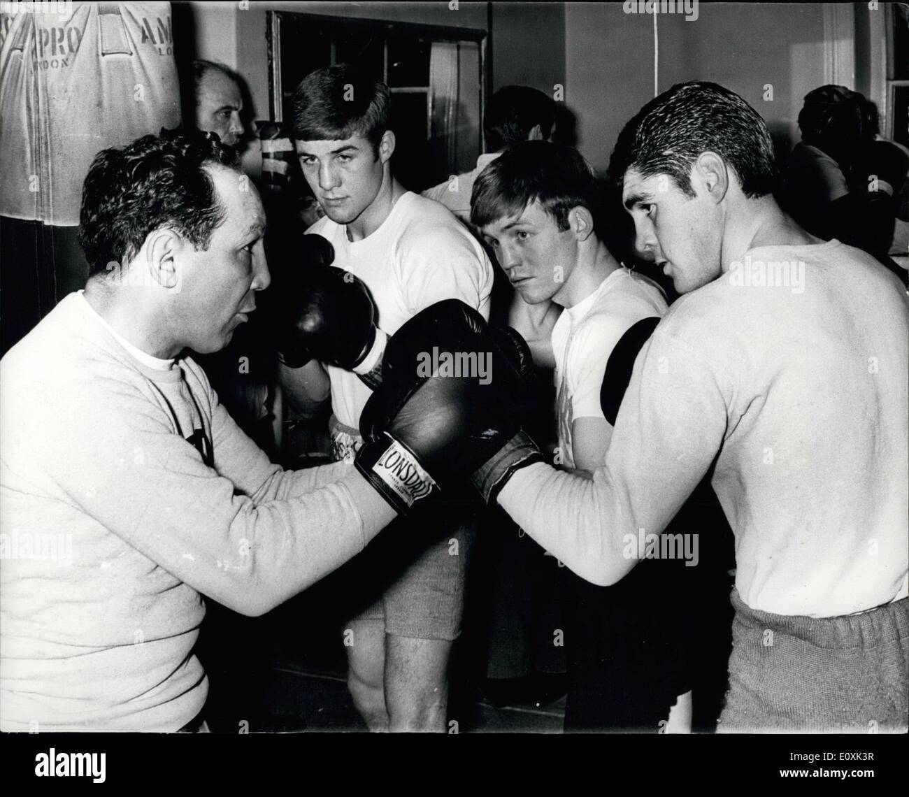 Feb. 02, 1967 - Tips from a Former World Champion. Photo Shows: Willie Pep, the former world featherweight champion, who is over here as a guest of the Anglo American Sporting Club, seen (on left) giving a few tips to British hopefuls, Mark Rowe, Alan Rudkin and Jimmy Anderson, at Freddie Hill's gym in King's Cross, London yesterday. Stock Photo