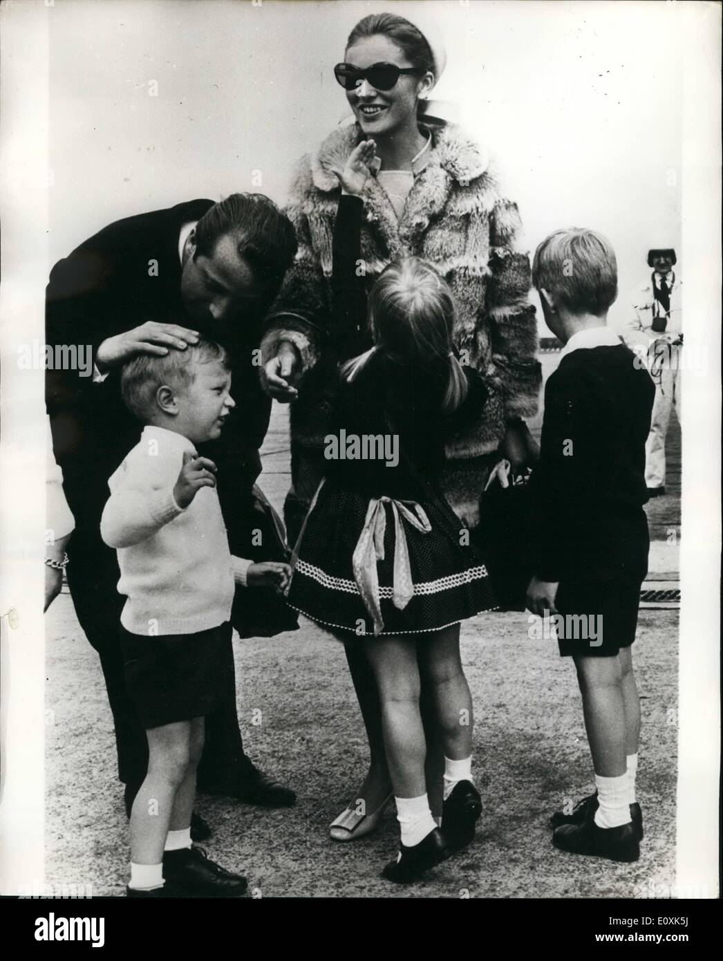 May 05, 1967 - Prince Albert and Princess Paola Return from Canada. Princess Albert and Princess Paola of Liege, arrived at Brussels arrived back at Brussels Airport on Tuesday after visiting Expo 67 in Montreal Canada. They were greeted at their airport by their children. Photo shows Prince Albert and Princess Paola are greeted by their children, Prince Laurent Princess Astrid and Prince Philippe, at Brussels Airport. Stock Photo