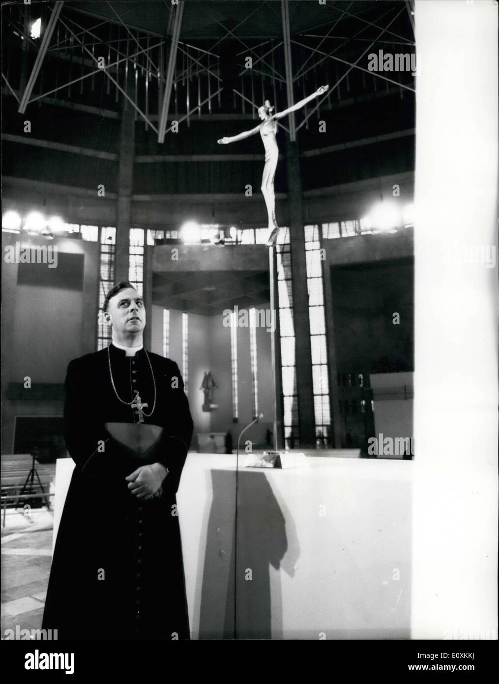 May 05, 1967 - New Liverpool Roman Catholic Cathedral to be consecrated tomorrow: The new Roman Catholic Cathedral, Christ the King, in Liverpool, will be consecrated tomorrow. Photo shows Bishop Harris, auxiliary Bishop of Liverpool standing by the High Altar, with a bronze crucifix-sculptured by Elizabeth Frank, of London. Stock Photo