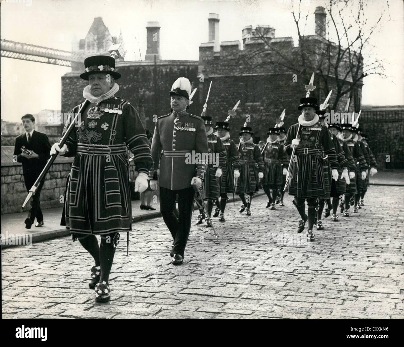 Mar. 03, 1967 - Easter day parade at the tower. The Easter day parade took place today at the tower of London when yeoman warders were inspected by the resident governor, cel. Sir Thomas butler, prior to marching to the chapel royal of St. Peter ad vincula for the service. photo shows The chief yeoman. warder G. Arnold. and the resident governor, col. Sir Thomas Butler, head the yeoman warders as they march to the chapel at the tower today. Stock Photo