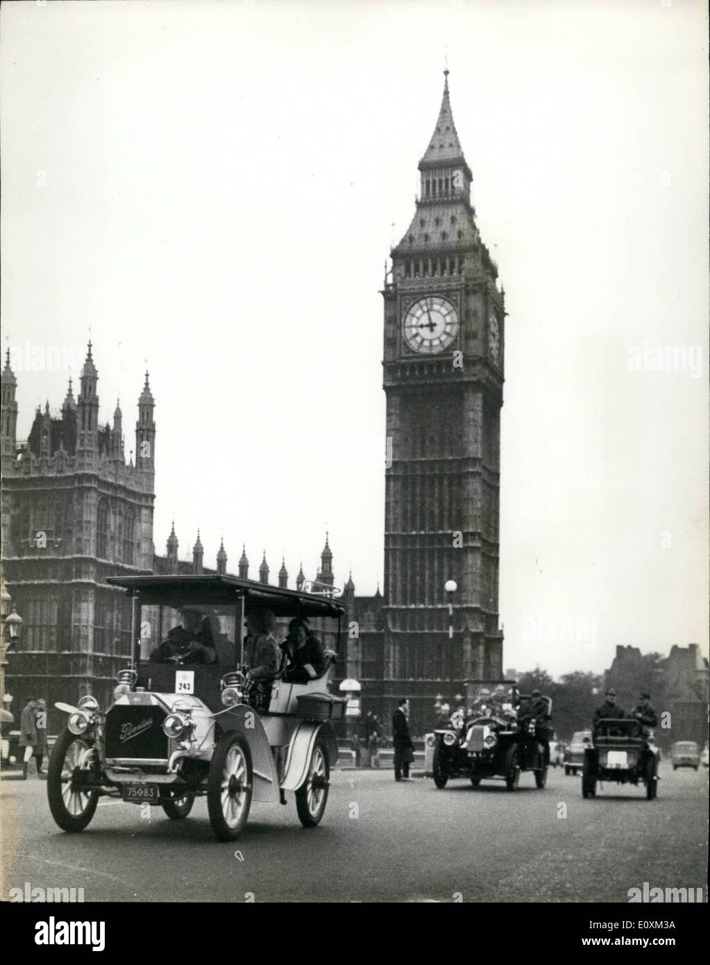 May 05, 1967 - Veteran Cars take Part in Commemoration run from Hyde Park to Brighton.: A record 283 Veteran cars built before 1905 were entered for the Royal Automobile Club's London to Brighton run which started from Hyde Park early this morning, Photo shows This veteran 1904 Peerless, entered by B. Upjohn is seen leading other veteran cars over Westminster Bridge this morning on their run to Brighton. Stock Photo