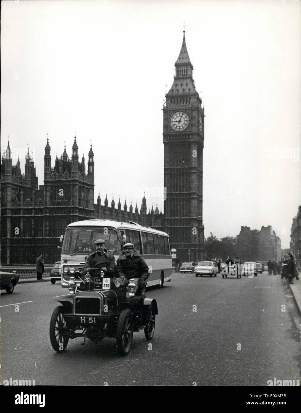 May 05, 1967 - Veteran Cars take Part in Commemoration run from Hyde Park to Brighton.: A record 283 Veteran cars built before 1905 were entered for the Royal Automobile Club's London to Brighton run which started from Hyde Park early this morning, Photo shows One of the veteran cars, a 1904 Swift, entered by G. Solomon is pictured alongside a modern coach as it passes over Westminster Bridge on its way to Brighton this morning. Stock Photo