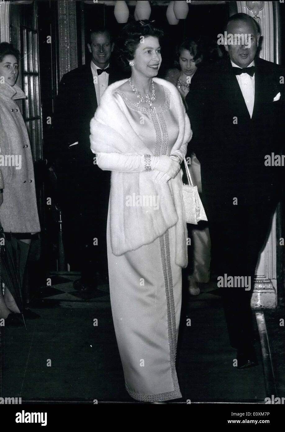 Apr. 04, 1967 - Queen Elizabeth Prince Philip and Children Attend First Night Comedie Francais At Aldwych Queen Elizabeth with Prince Philip, Prince Charles and Princess Anne, attended the first night of the Comedie Francaise, at the Aldwych Theatre. Later, after the performance the Royal Family will attend a dinner party at the French Ambassador's home, the cast of the show will also be at the dinner. Photo Shows:- The Queen, on arrival at the theatre is escorted by Mr. L.G.T Stock Photo