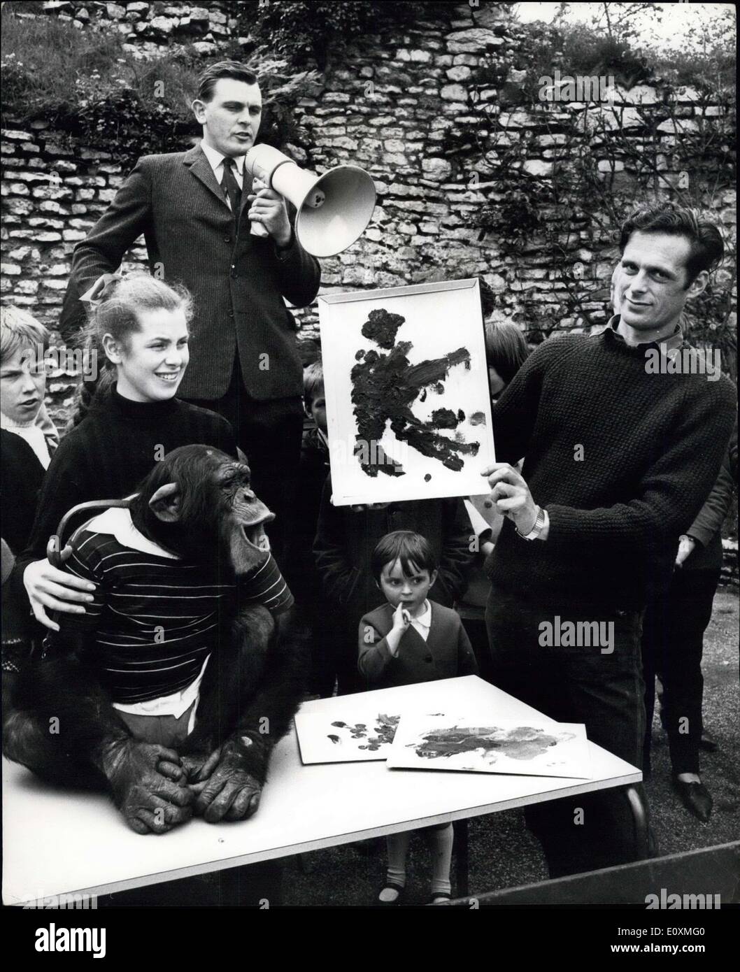 May 31, 1967 - Works of Art by an Ape are Auctioned. Fifteen of the paintings by a five year old ape, Cindy Lou, who has been painting multi colored splodges for year at the Dudley Zoo, Worcester, were sold at an auction. The auction was conducted by BirminghamHorst Klose None of the first 10 lots reached the mark. But then, when lot II was shown, Mr. David Earle, a 30 year old surveyor from Henley in Arden, Warwicks, paid 5.10s after a brisk bout of bidding. altogether the auctioned raised 9.8S.6d. for the World Wildlife Fund Stock Photo