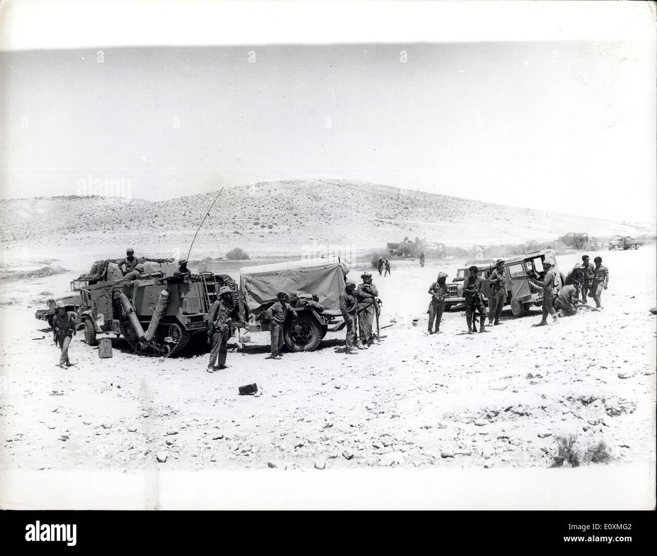 May 31, 1967 - The Tension In The Middle East Scenes In The Negev Desert. Photo shows Israeli soldiers take it easy as they stand beside their army trucks in an encampment in the Negev Desert. Stock Photo