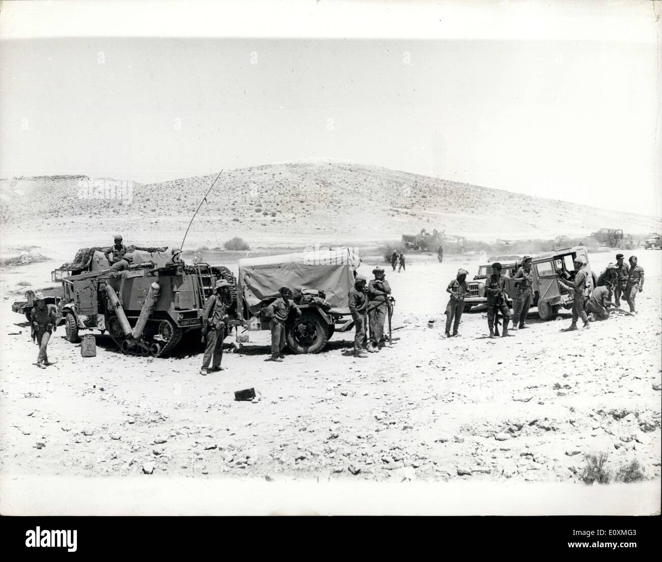 May 31, 1967 - The Tension In The Middle East Scenes In The Negev Desert. Photo shows Israeli soldiers take it easy as they stand beside their army trucks in an encampment in the Negev Desert. Stock Photo