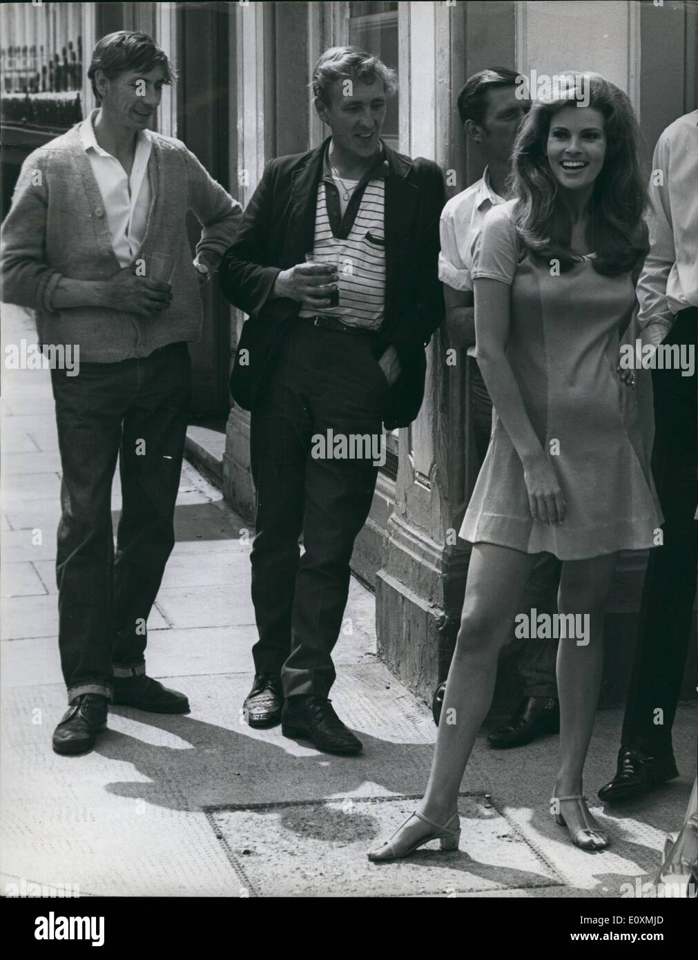 Jun. 06, 1967 - Raquel Welch On Location For ''Bedazzled'': Photo shows Actress Raquel Welch pictured in Fulham yesterday, where she was on location for the film ''Bedazzled'', which she is making with Peter Cook and Dudley Moore. The man in the picture is not in the film - he just happened to be around. Stock Photo