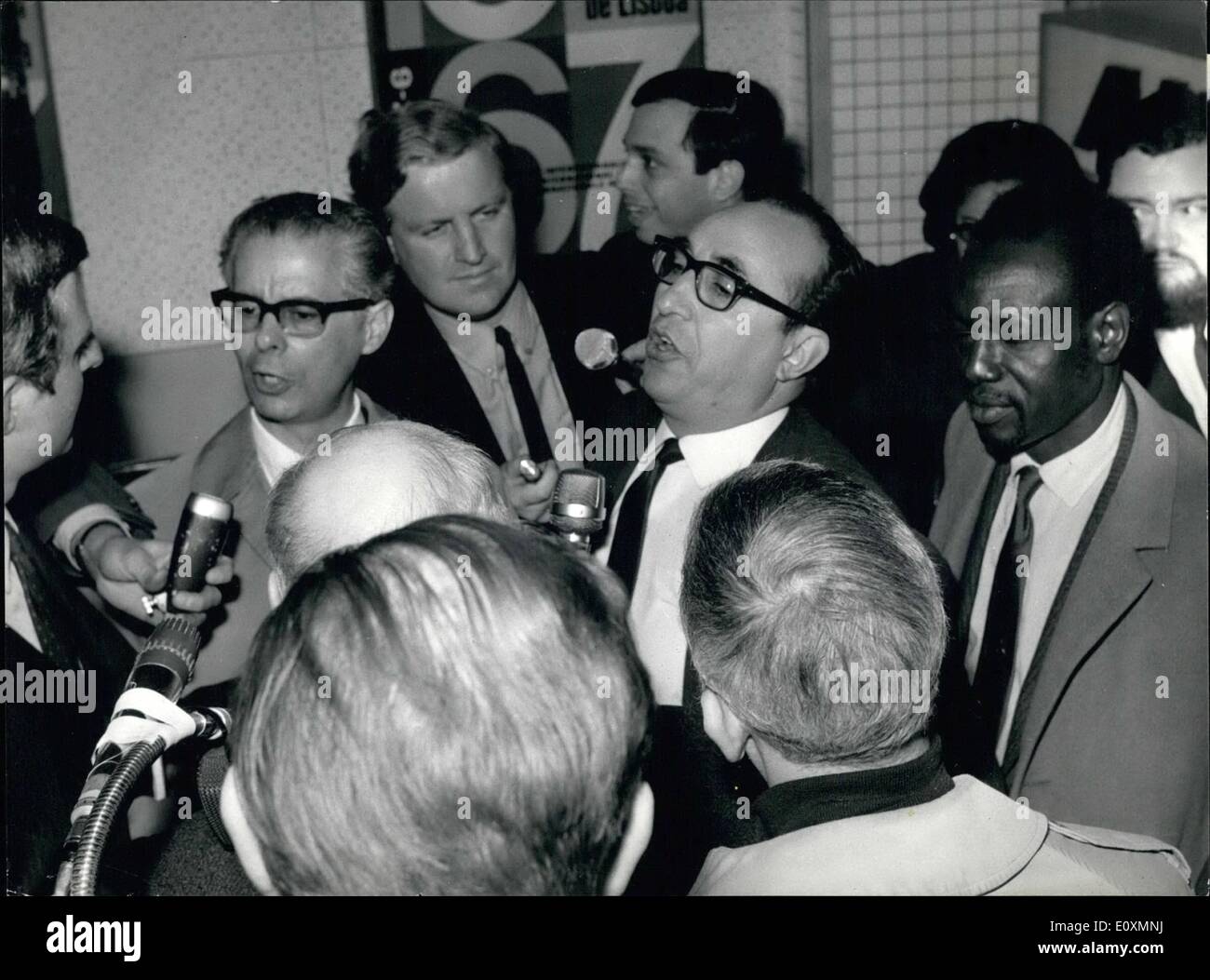 Apr. 04, 1967 - The UNO commission for Aden arrived at Geneva: The UNO commission which left Aden because of alleged non-cooperation from the British has arrived at Geneva, where they will make up their report. The UNO Aden-commission arriving at Geneva airport, where journalists were eager to question them. From left to right (both with spectacles) dr. Manuel Guerrero (Venezuela, head of the commission), Abdul Shalizi (Afghanistan) and Mussa Keita (Rep. of Mali) Stock Photo