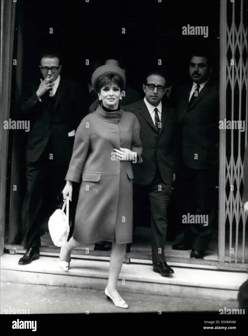 Apr. 04, 1967 - Italian actress Gina Lollobrigida and French actor Jean Sorel went to the Court for the trial of appeal. They are accused to work in the film ''Le Bam bole'' (the dolls), in a scene considered immoral by the Court. The first court condamned them to two months of reclusion. Photo shows Gina leaves the Cine Ariston where the Court watched the incriminated scenes of the film. Gina is accompanied by her lawyer Bavaro. Stock Photo