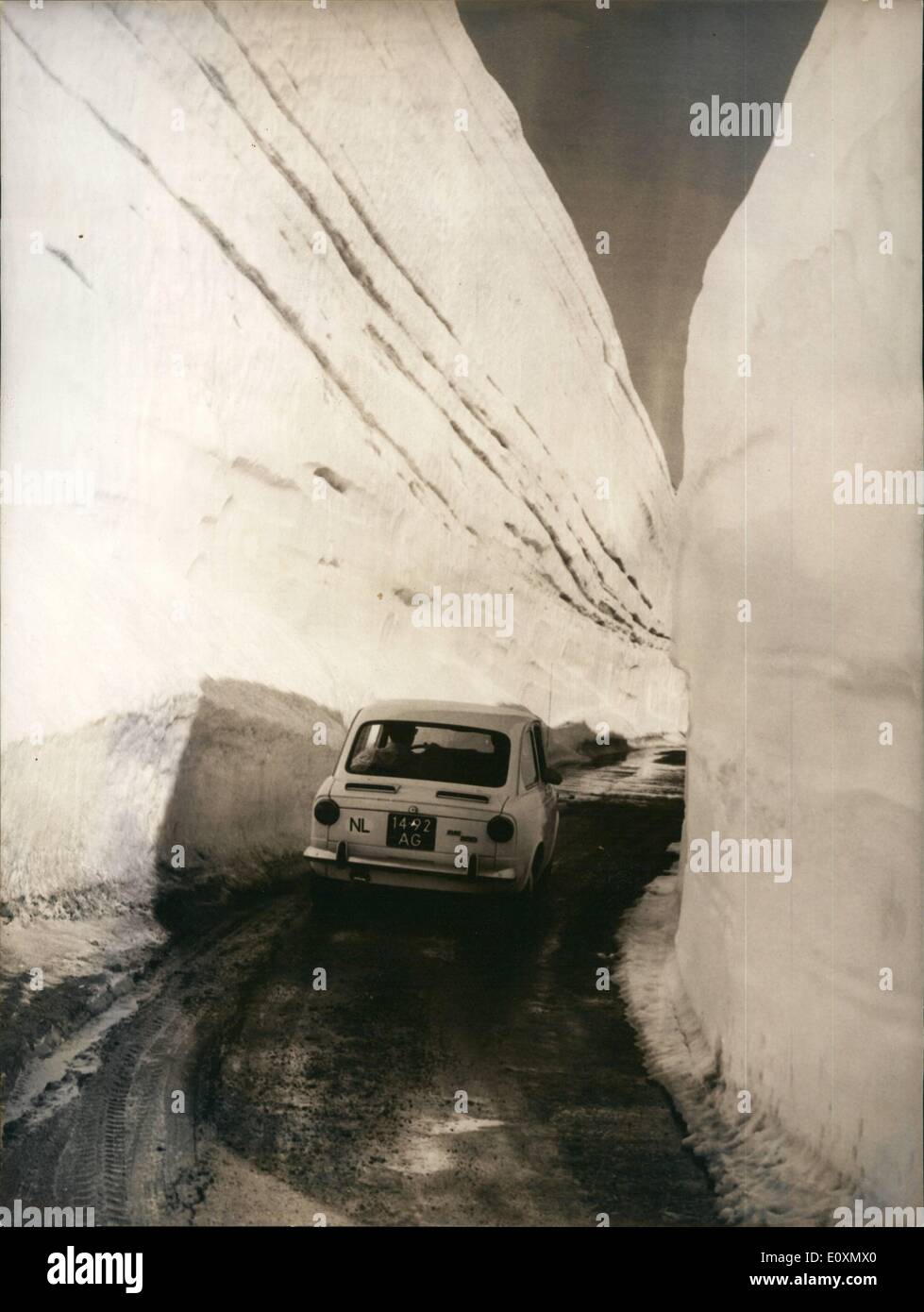 Jun. 06, 1967 - Switzerland opens 2161 meters Grimsel pass road one of the first cars passing after this years opening of the Grimsel road near the top, where snow is still 16 meters high. Stock Photo