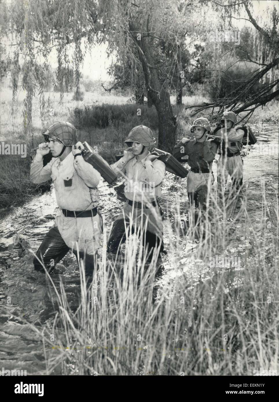 Apr. 08, 1967 - Argentinas Military Forces are Doing ''Realistic Anti Guerrillas Training'': Near Ezeiza air port, some 25 kilimeters of teh argentine capital there are taking place actually instructions to cadets of the Gendarmeria National at the most realistic way possible to be prepared to fight against the increasing of the Castro-communist Guerrilla activities on the argentine-bolivian frontier- Here are members of the argentine Gendarmeria Nacional during their realistic maneuvers against guerrillas. Stock Photo
