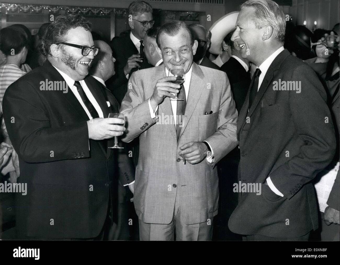 Jun. 06, 1967 - Mr Edward Heath at Variety Club Ladies' Lunch: The Rt. Hon. Edward Heath, M.P., leader of the opposition, was guest of Honour at the variety club of Great Britain's Ladies' Luncheon, at the Dorchester Hotel, Park Lane, London, today. The annual lunch is the only one of the year to which Variety members may invite ladies, all of whom receive a gift of beauty requisites. Photo shows (L. to R.), Comedian Harry Secombe, H.E. Aharon Remez, the Israeli Ambassador, and Edward Heath M.P., Leader of the opposition, share a joke together at the luncheon today. Stock Photo