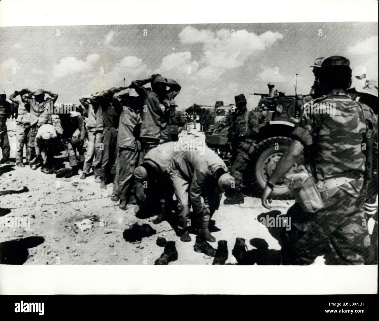 Jun. 08, 1967 - War in the Desert: Photo Shows A unit of Egyptian soldiers takes prisoners, most of them without boots which enable them to retreat faster in the desert. Stock Photo