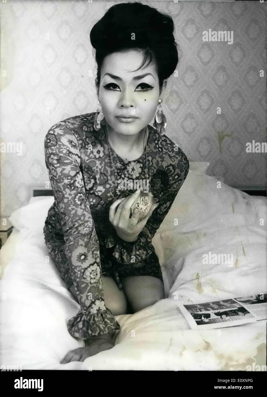 May 05, 1967 - Her Majesty takes off her clothes nightly; The Princess Quan Minh-Kim Hoang (25), aristocratic from Vietnam and Madamae Mhus niece, dances strip tease every night for four weeks in Dortmund. She will get ca 545 netto for 30 days in the revue-cabaret ''Winter garden''.. The princess lives since some years in Paris and was originally studing at Sorbonne, until she was photographed. First in clothes, then in gradually less clothes. Now she crosses the hearts in the Near East as well as in Europe. Stock Photo