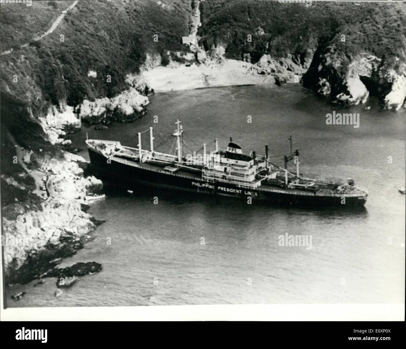 Jul. 07, 1967 - Ship aground in Guernsey: The Philippine vessel, President Garcia, a 10,826 ton cargo ship crashed full speed into the rocks of Southern Guernsey during the night. Today the ship, the Philippine Garcia was high and dry in Saints Bay. Her crew of 53 was safe. Photo shows aerial view of the cargo ship President Garcia aground off the coast of Guernsey today. Stock Photo