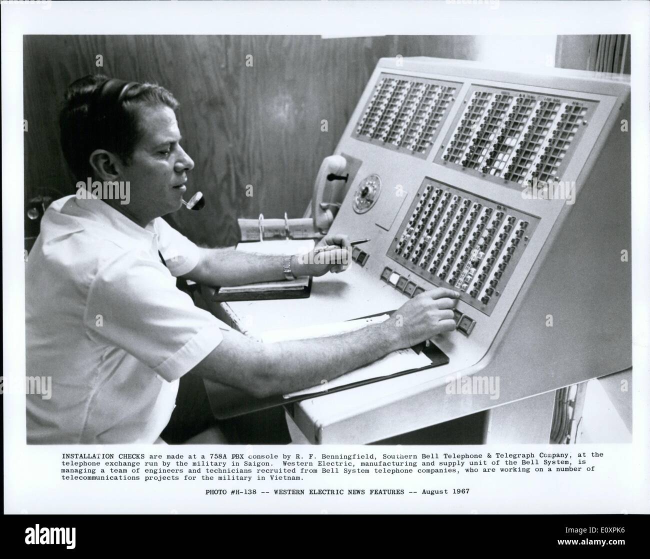 Aug. 08, 1967 - Installation Checks are made at a 758A PBX console by R. F. Benningfield, Southern Bell Telephone & Telegraph Company, at the telephone exchange run by the military in Saigon. Western Electric, manufacturing and supply unit of the Bell System, is managing a team of engineers and technicians recruited from Bell System telephone companies, who are working on a number of telecommunications projects for the military in Vietnam. Stock Photo