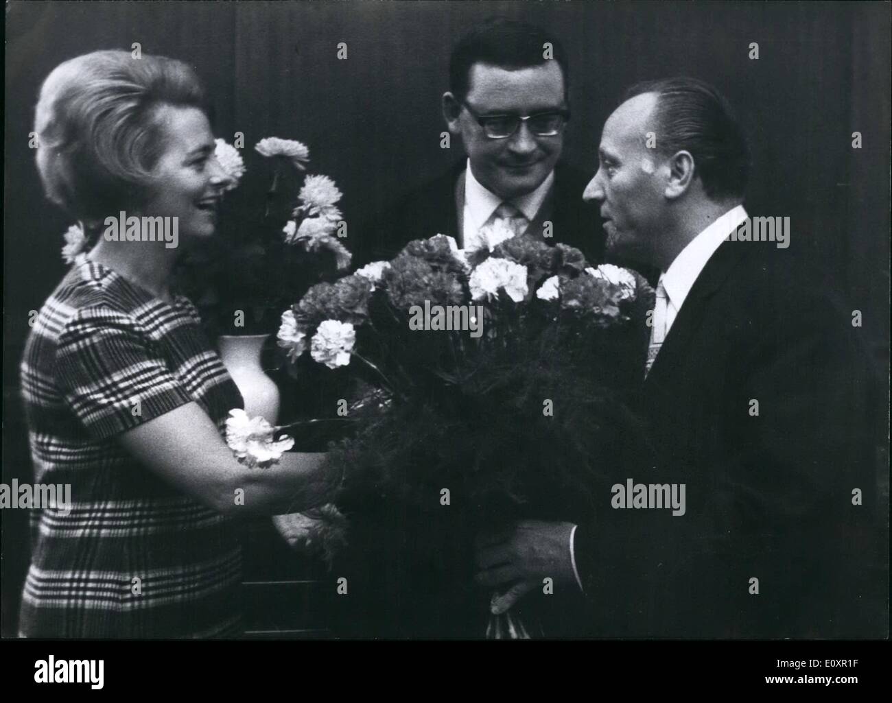 Oct. 10, 1967 - The President of the house of Parliament Mr. Sickert (r) gratulated with flowers to the new first lady of West-Berlin (Mrs. Schutz). In the middle the new Lord-Mayor Klaus Schutz. Stock Photo