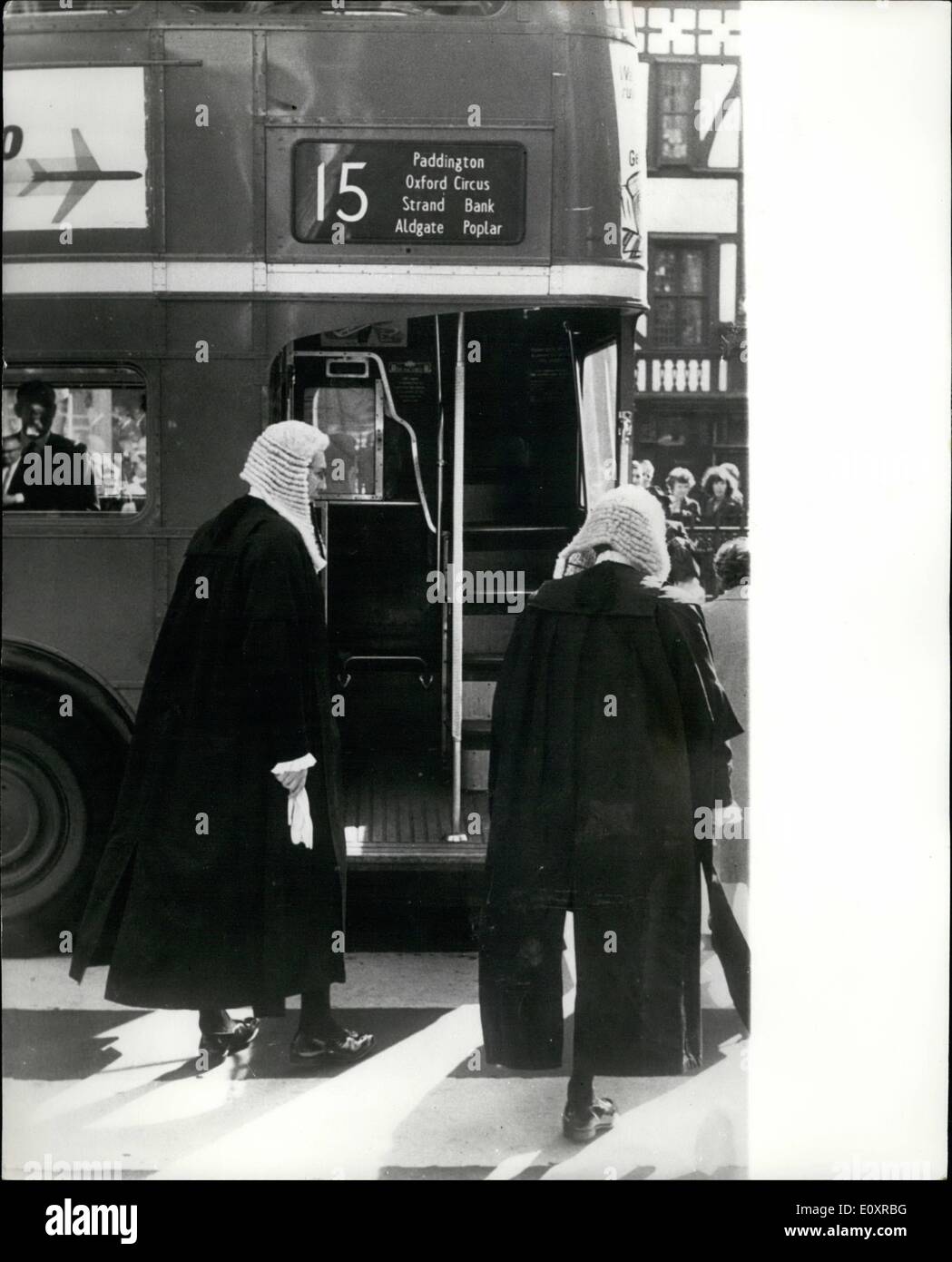 Oct. 10, 1967 - Opening Of New Legal Year: The ceremonial opening of the new legal year took place yesterday at the Law Courts in London. Photo Shows: Two barristers who did not take part in the procession at the main hall of the Royal Courts of Justice - look as though they are about to board a bus - but it was only that they were confronted by it when they to cross the road to the Temple and chambers to continue urgent cases. Stock Photo