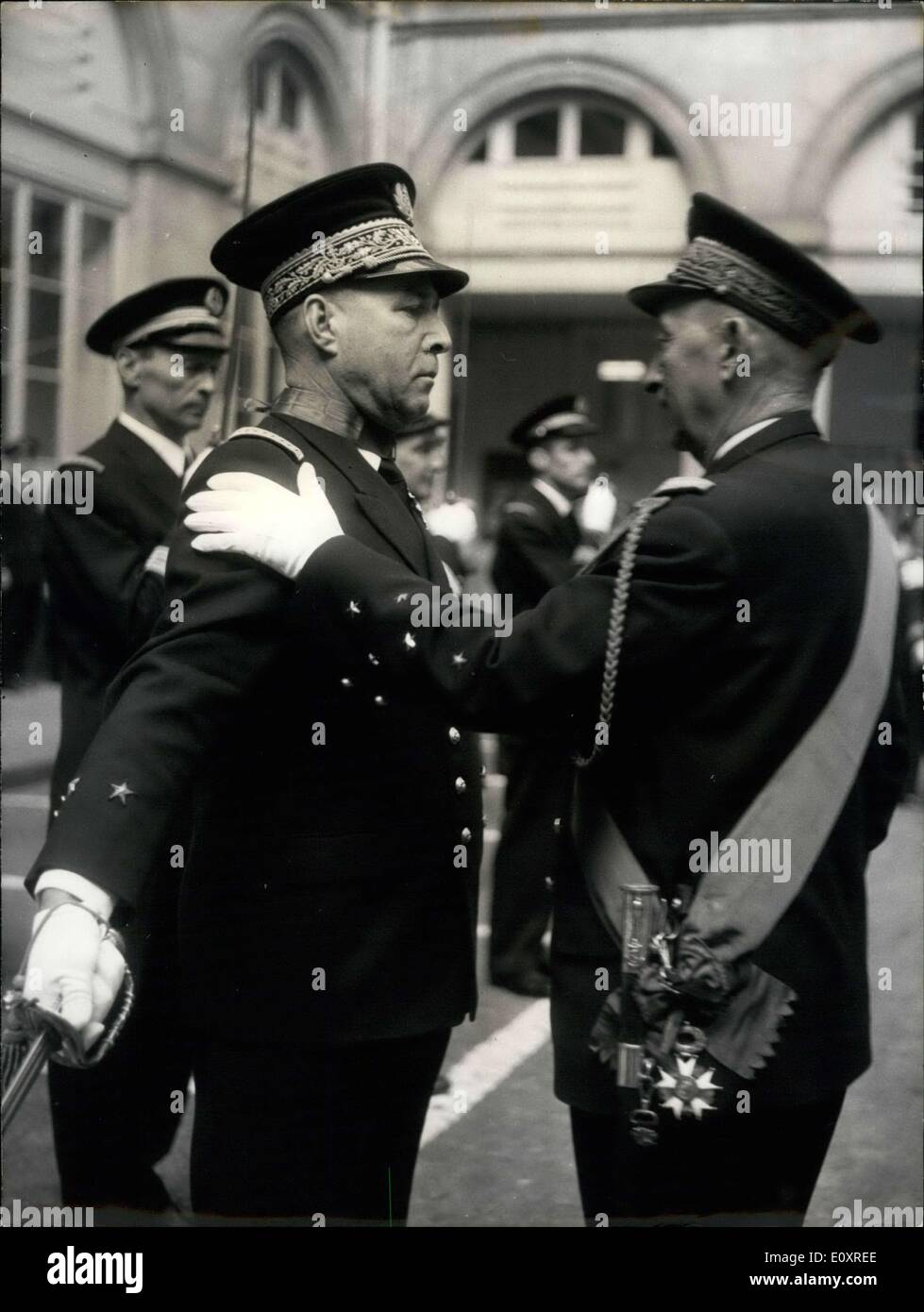 Oct. 20, 1967 - Naval Officers Awarded Decorations: Decorations were Awarded to naval officers at a ceremony held in the court yard of the Marine Ministry, Paris. This morning. Photo shows Admiral Cabanier, chief of staff of the French navy, awarding the insignia of the commander of the Legion D'Honneur to rear admiral clotteau. Stock Photo