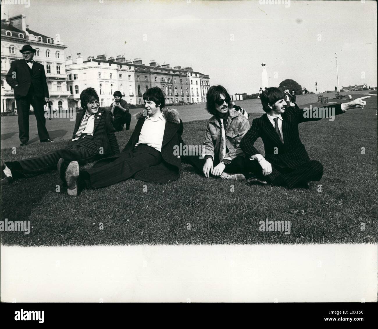 Sep. 09, 1967 - The Beatles In The West Country: The Beatles in the West Country making a 60-minute colour TV spectacular Magical Mystery Tour, which depicts a coach journey through the West Germany. Which depicts a coach journey through the West Country. Photo shows The Beatles seen sitting on a grass bank above Plymouth Hoe, during a short stop. Stock Photo