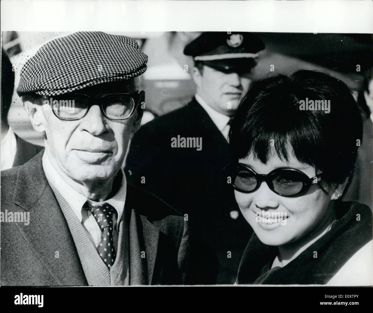 Sep. 09, 1967 - Henry Miller and His Bride Arrive in Paris. Henry Miller the 79 year old author from America arrived in Paris this afternoon with his 29 year old Japanese Bride Hoki Tokuda who is a singer. This is Henry Miller's fifth bride. Photo Shows: Henry Miller and his Japanese bride who he married last week in Los Angeles seen arriving in Paris for their honeymoon. Stock Photo