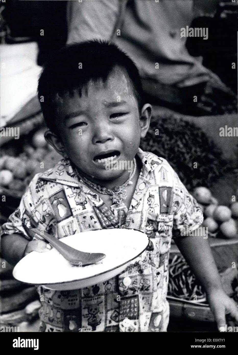 Nov. 16, 1967 - Like a hound ... wailed the little Thai ... and the reason for this is neither the empty plates, nor a beating that he was given, but the mean photographer who wanted to take a picture of him. Normally, the boy could have run away to hide from the gunfire, but in this case, Mom insisted that a picture be taken in the Bangkok market, and so the little man had no choice but to make a bad face. In this scene Mom will always have to think when they look on the photo at least that of the Shrew has been reached. Stock Photo