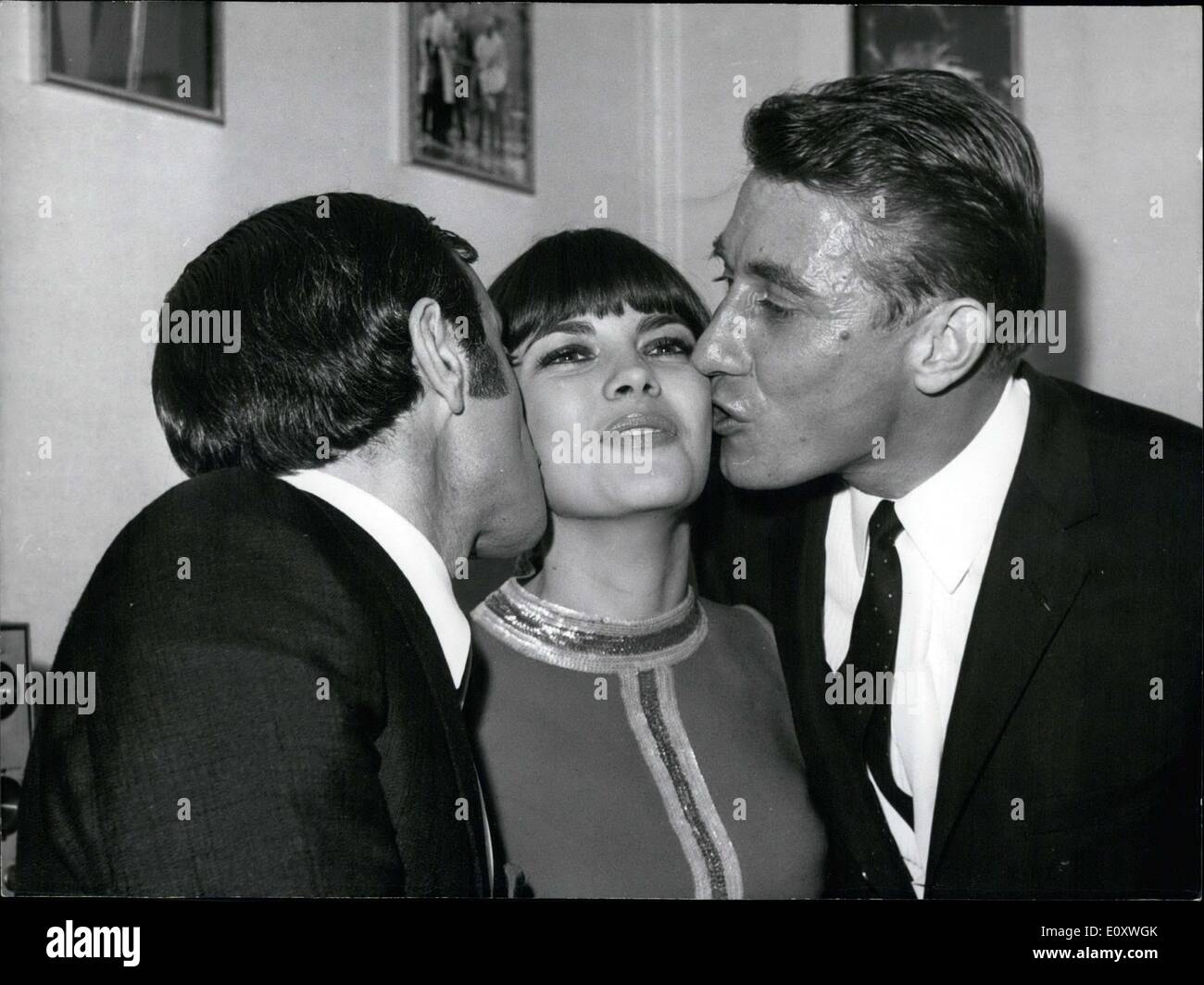 Dec. 15, 1967 - Charles Aznavour and Jacques Anquetil Kissing Mireille Mathieu Stock Photo