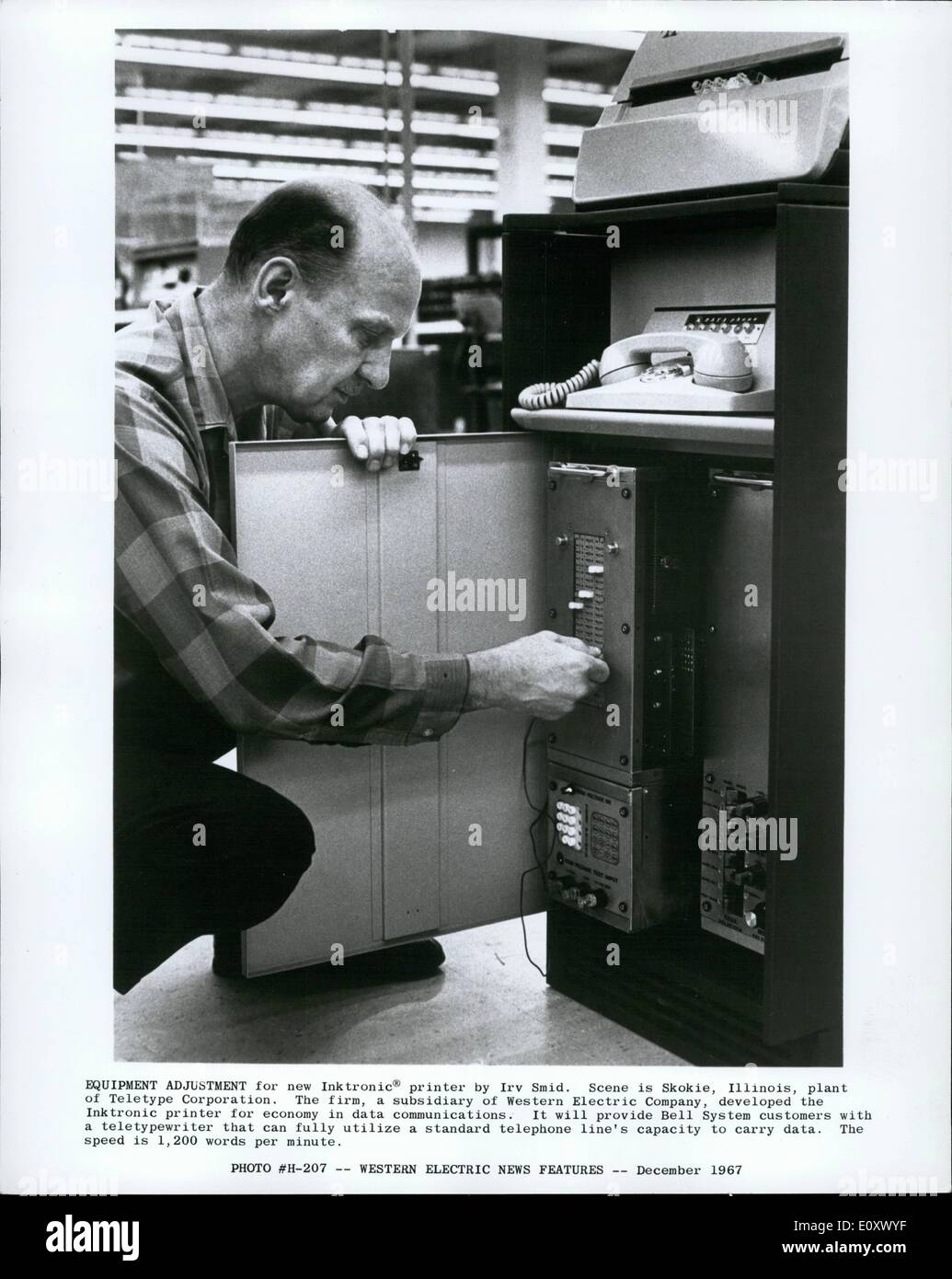 Dec. 12, 1967 - Equipment adjustment for new Inktronic printer by Irv Smid. Scene is Skokie, Illinois, plant of Teletype Corporation. The firm, a subsidiary of Western Electric Company, developed the Inktronik printer for economy data communications. It will provide Cell System customers with a typewriter that can fully utilize a standard telephone line's cpacity to carry data. The speed is 1,200 word per minute. Stock Photo