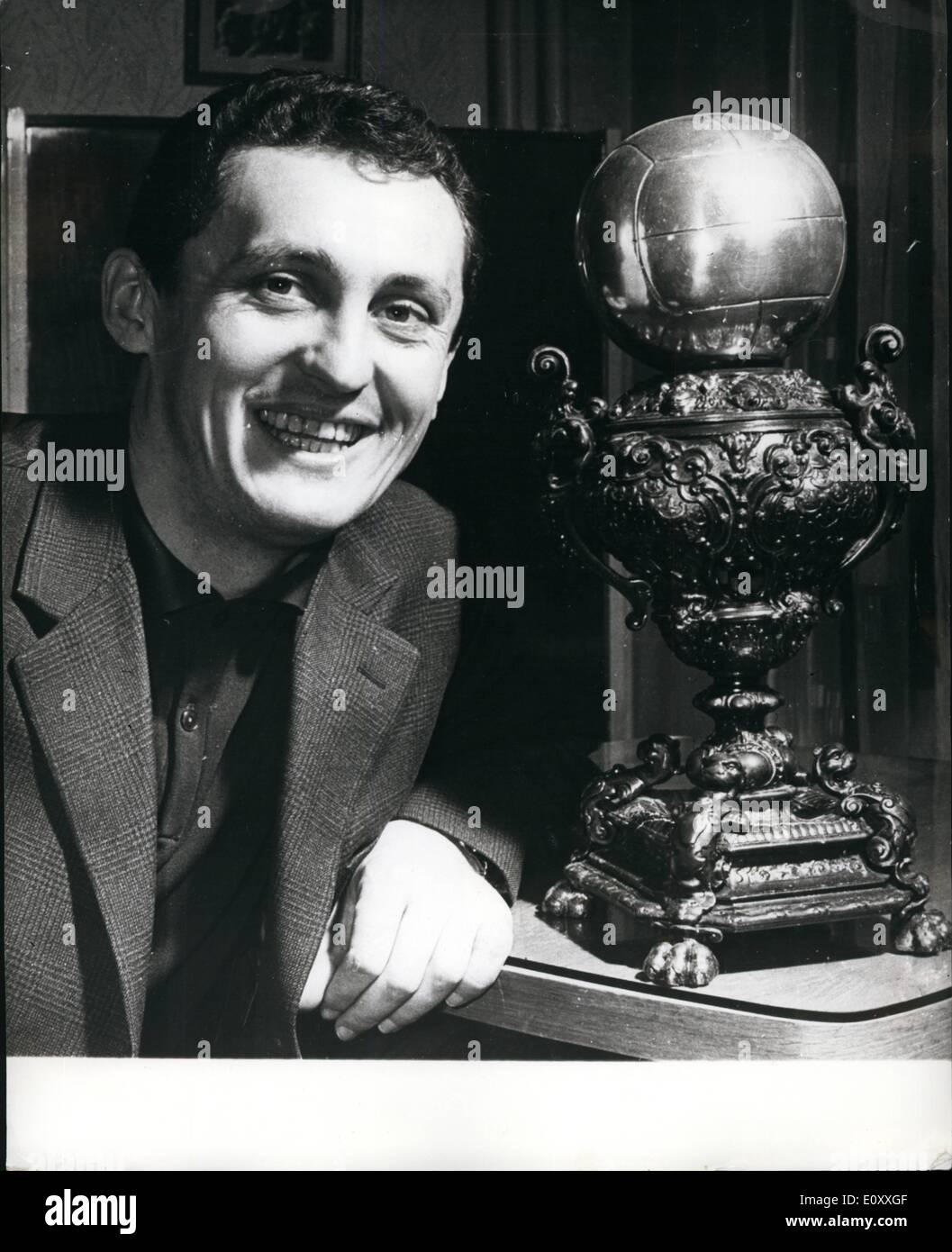 Jan. 01, 1968 - Fan Sends A Trophy To Florian Albert. Hungarian footballer, Florian Albert, the European Player of the Year 1967 - pictured with a decorative challenge trophy presented to him by Imre Heredi, an enthusiastic fan from Kiskunfelegyhaza. So this country town on the Great Hungarian plain preceded Paris from where Albert is to be awarded the official Golden Ball. Stock Photo