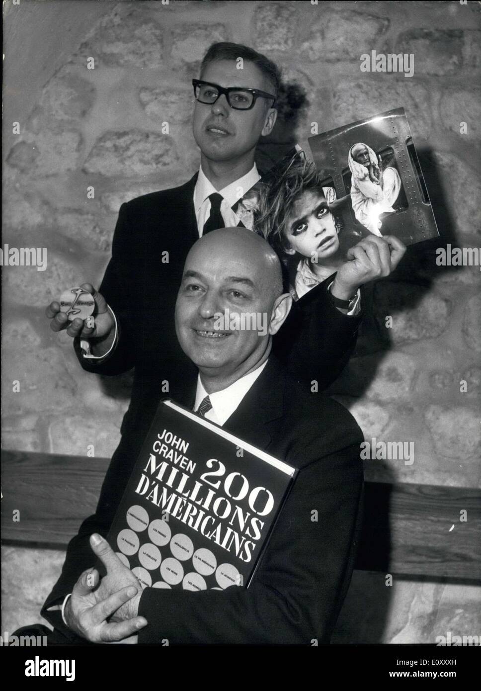 Mar. 28, 1968 - Journalist Claude Sauvageot won the Niepce Prize for his collection of photos that he took in India. John Craven won the Nadar Prize for his book ''200 Million Americans''. The two men are posing with their award-winning work. Stock Photo
