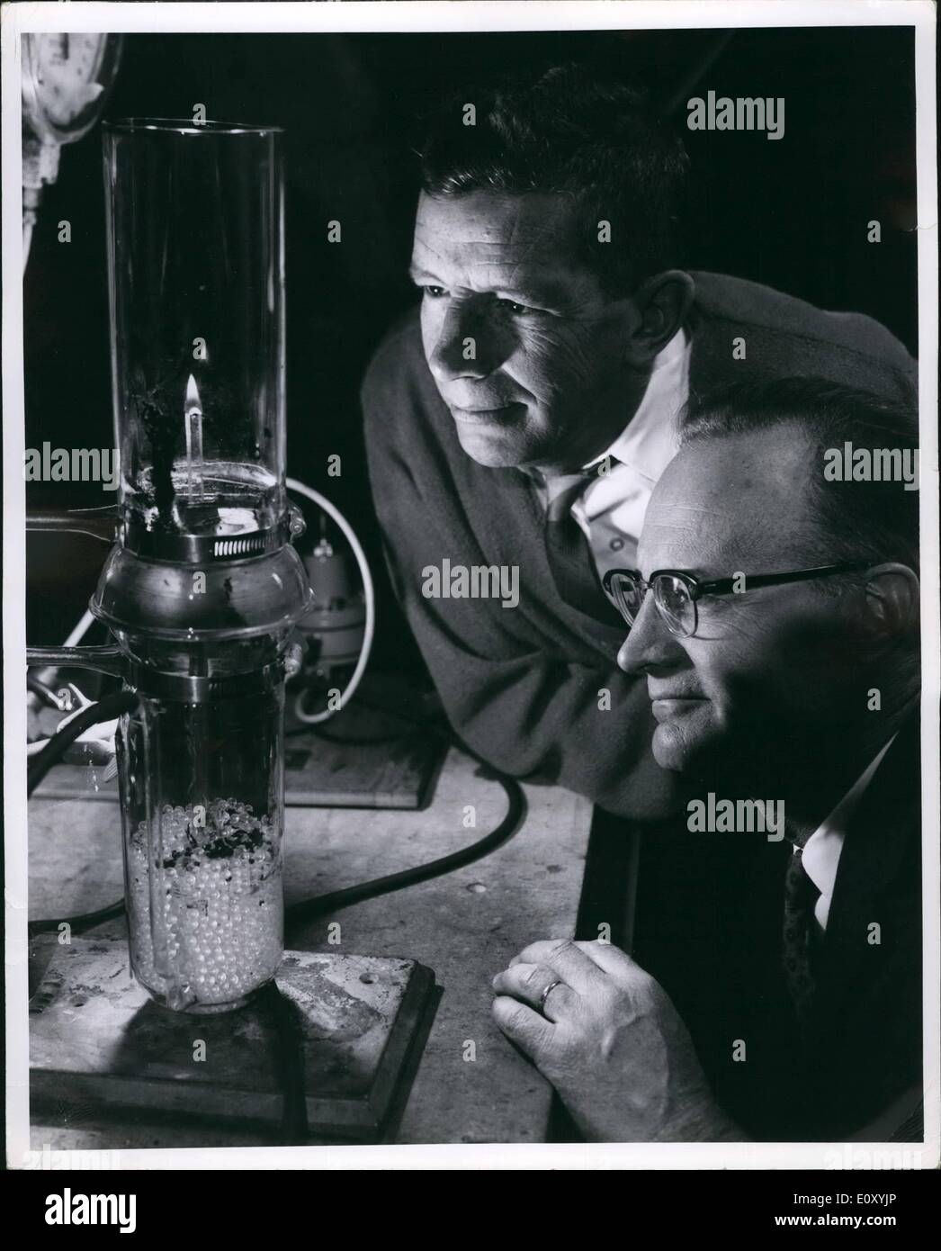 Feb. 02, 1968 - A highly sensitive and easily reproducible technique for determining the relative flammabilities of plastics and synthetic fabrics has been developed by two scientists at the General Electric Research and Development Center. Developed by Drs. Charles P. Fenimore ( left ) and Frederick J. Martin, the new technique utilizes a simple, compact apparatus in which samples are burned in a ''candle-like'' manner in combinations of selected gases to determine the minimum oxygen concentration that will support burning Stock Photo