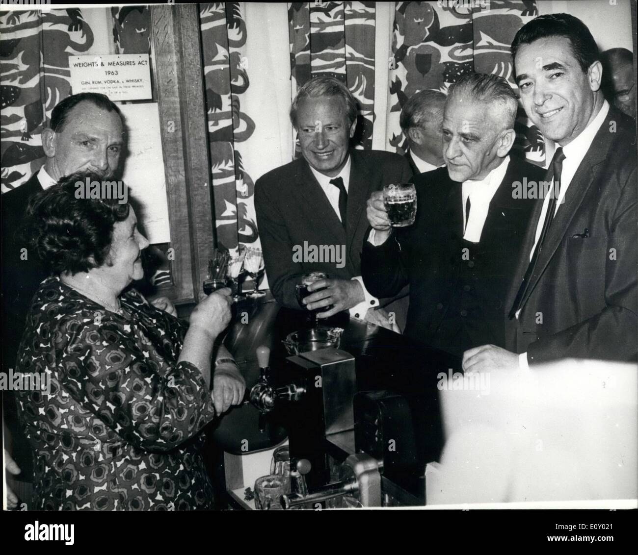 Apr. 04, 1968 - Just like old times. Octogenarian Miss Annie Gilbert, original Annie of Annie's bar in the house of Commons, returned to the palace of Westminster last night, to take a drink with old friends at the opening of the new Annie's Bar, Toasting her are the speaker, Dr, Harold King (centre) Mr. Edward Heath , leader of the opposition, and Captain Robert Maxwell, labour MP of Buckingham and chairman of the catering Sub-Committee at the house (right) Miss Gilbert, who has been housebound with arthritis (right) the past three years at her home in Sutton Stock Photo