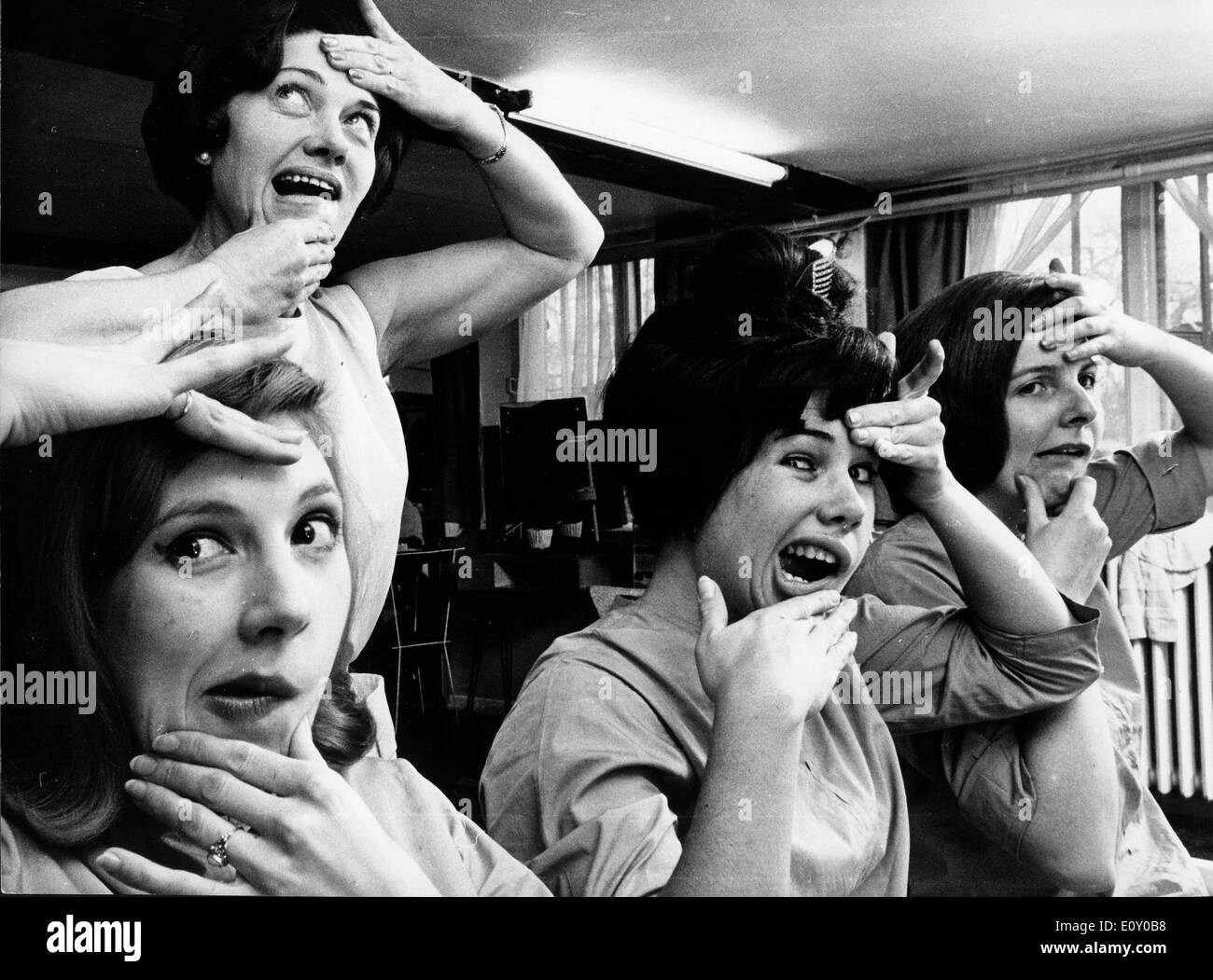 Women making faces in beauty salon Stock Photo