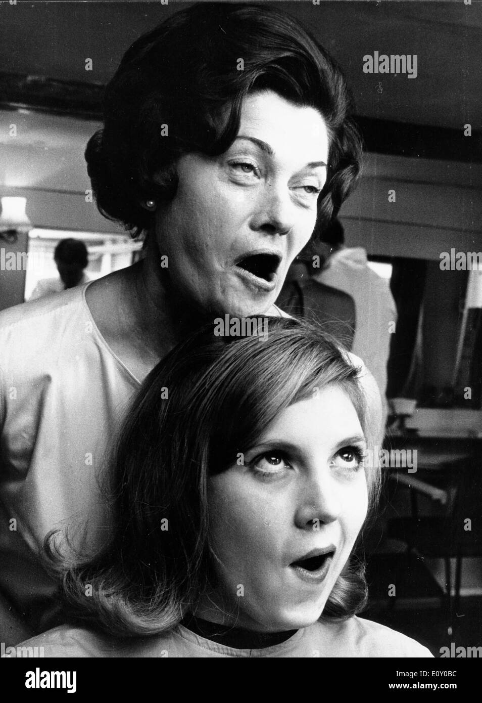 Women making funny faces at beauty salon Stock Photo