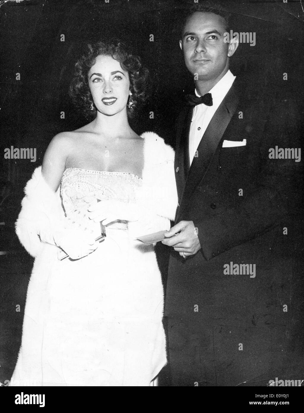 Actress Elizabeth Taylor attends event with escort Stock Photo