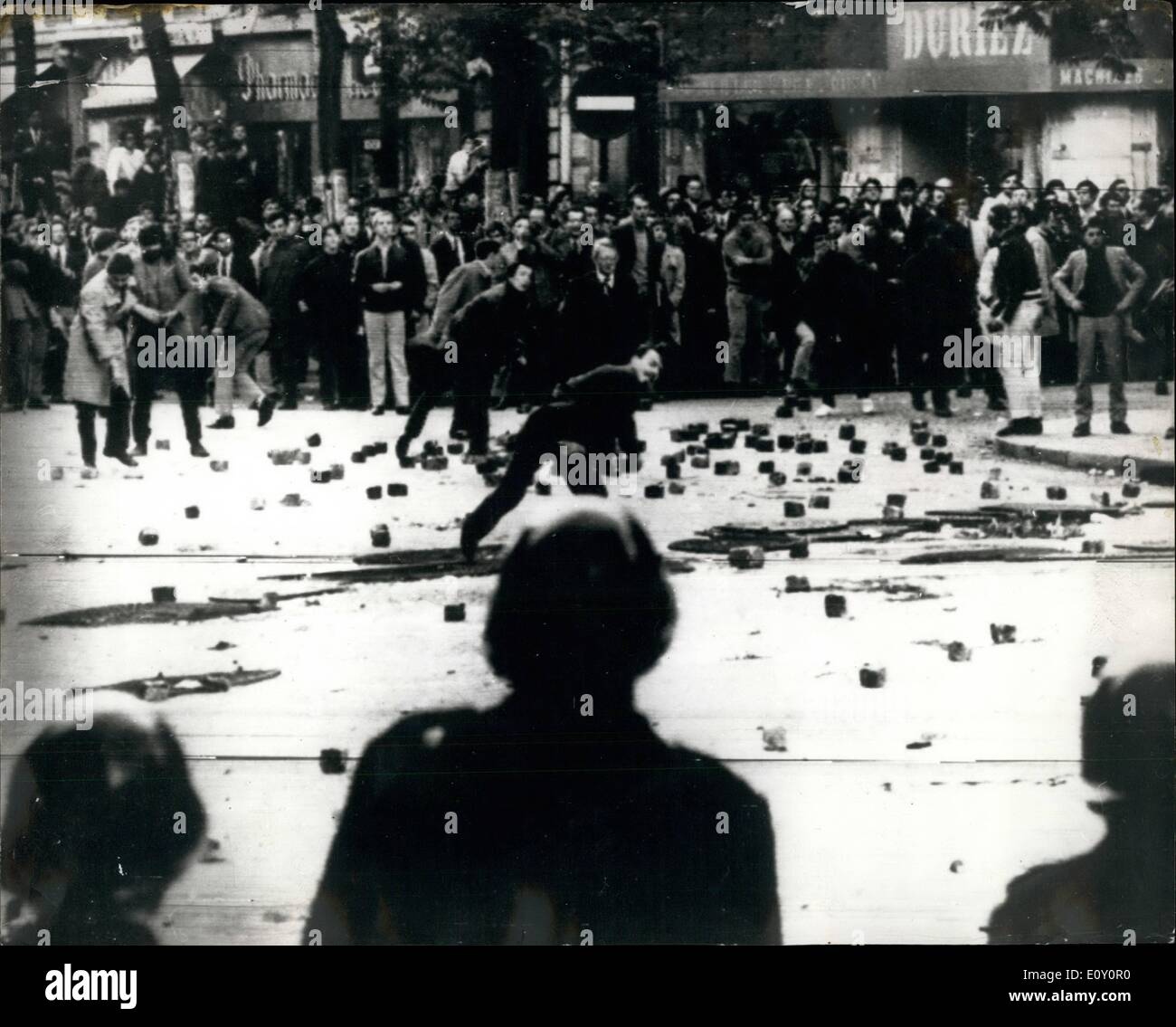 May 05, 1968 - Rioting Student Clash with Police in Paris Tear gas and hoses were used during yesterday's clash with French students and French riot Police during a demonstration in the University area of Paris. The students were protesting against conditions at the Sorbonne and against the closure last week of the Faculty of Letters in Manterre. Photo Shows: Some of the student demonstrators are seen stoning the police during yesterday's disturbance. Stock Photo