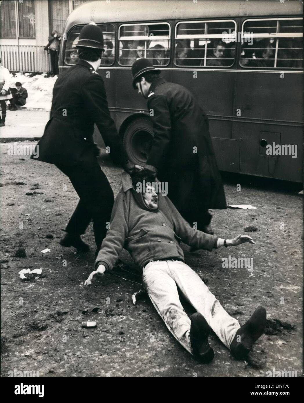 Mar. 03, 1968 - Vietnam Battle: Two policemen drag off a young demonstrator in the Battle of Vietnam in London's Grosvenor Square outside the U.S. Embassy today when thousands of demonstrators besieged the Embassy protesting against the Vietnam war. The Protestors fought with the police and many arrests were made. Stock Photo