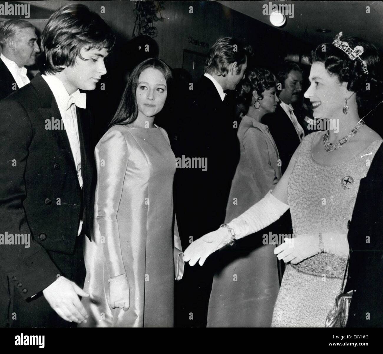 Mar. 03, 1968 - QUEEN MEETS ROMEO AND JULIET, H.M. THE QUEEN talking with OLIVIA HUSSEY and LEONARD WHITING, young stars of Romeo aad Juliet, prior to the Royal Film Perfornance at the Odeam, Leicester Square, London, last night. Olivia, at 15, is the youagest actress ever to play the role of Juliet professioxally, She is the daughter of at Argeatiae opera singer and ax English mother. Stock Photo