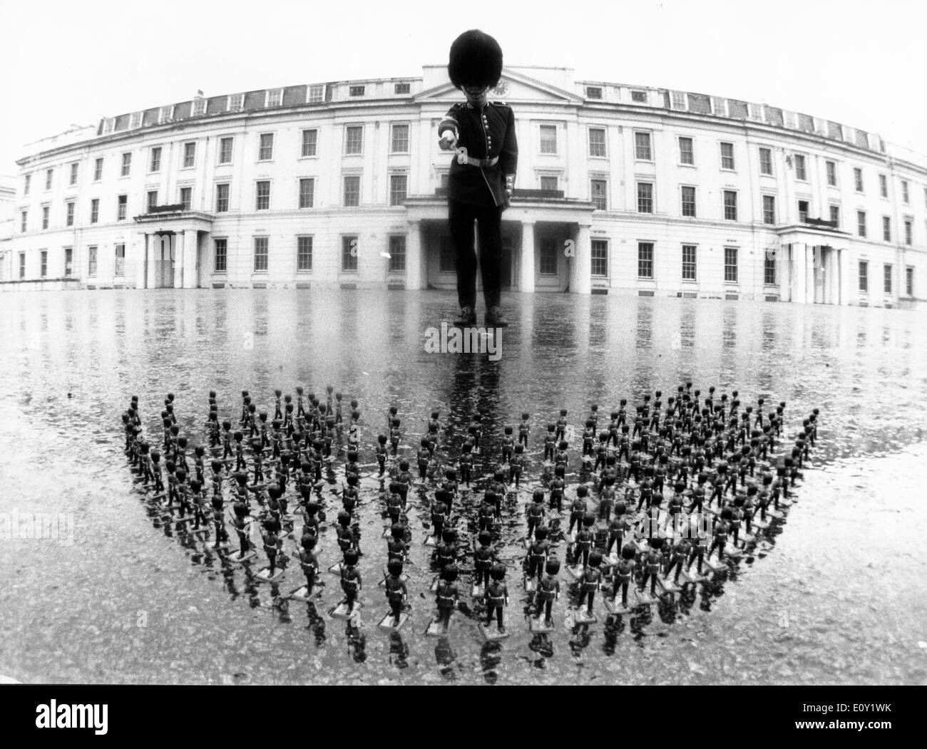 Guard with toy soldiers in front of palace Stock Photo